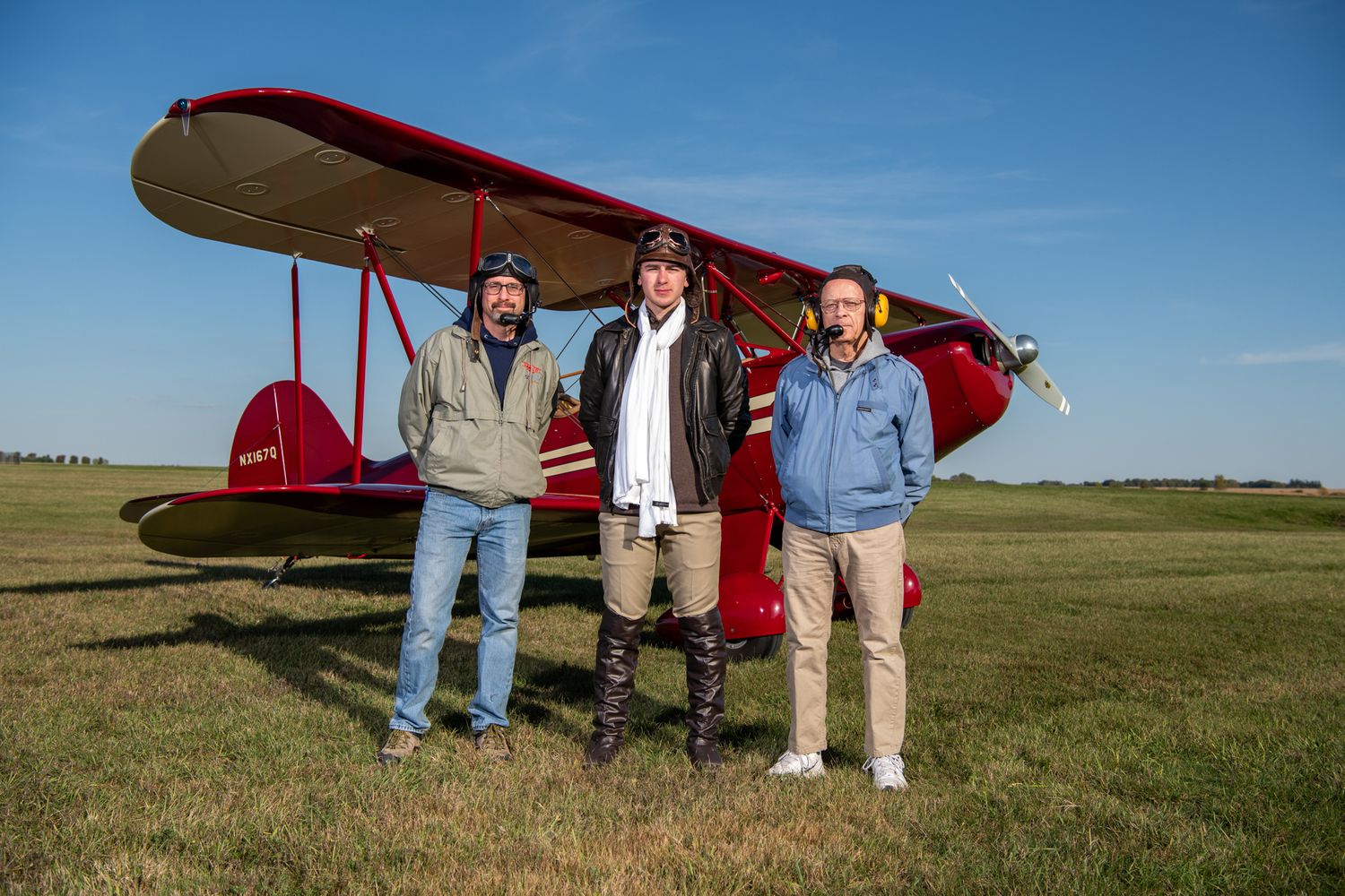 Hatz Classic with aviators posing in front of it.