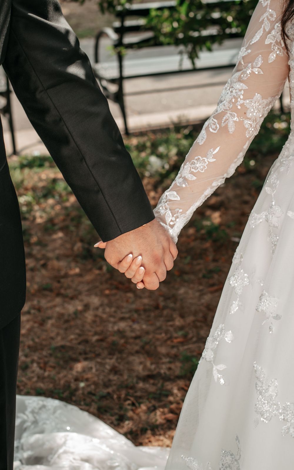 bride and groom holding hands at their first look