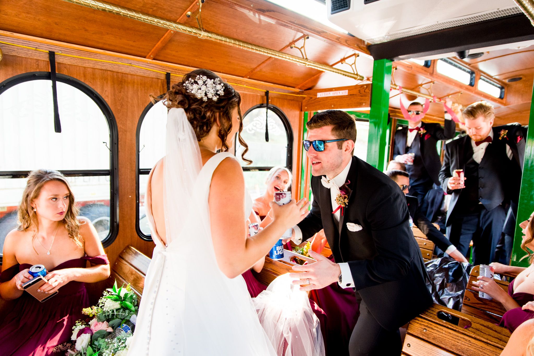 celebratory drinks with the bride and wedding party on a trolley in chicago
