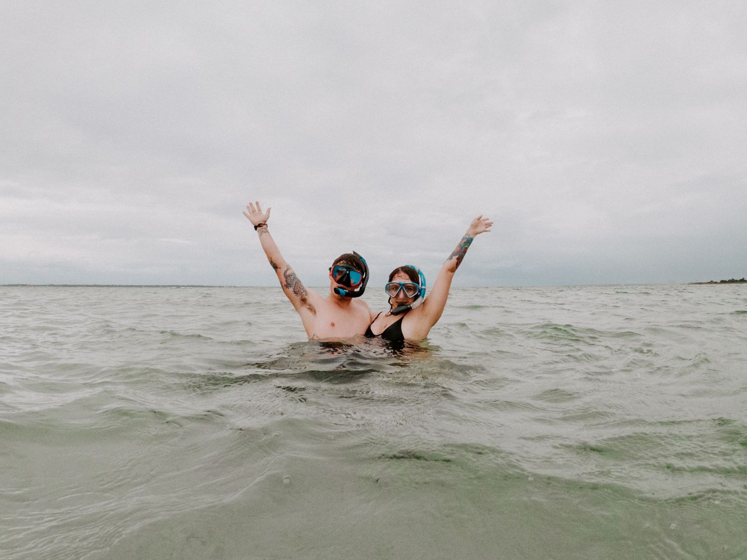 couple excited after snorkeling during their couples session