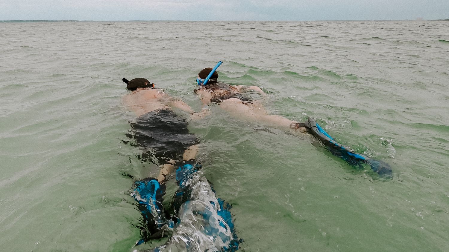 couple snorkeling during their adventurous elopement