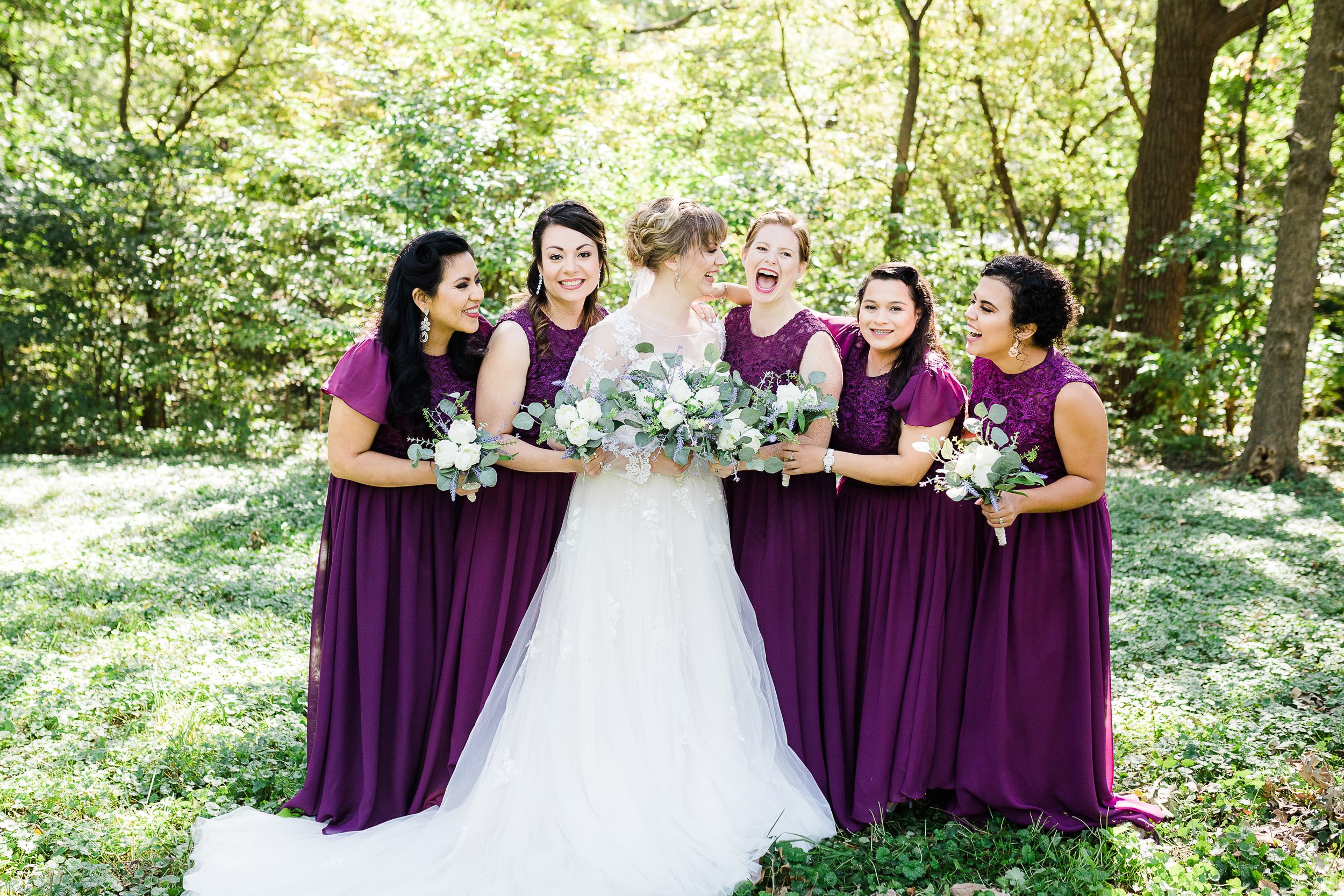 Bride and bridesmaids laughing by Hudson Valley wedding photographer