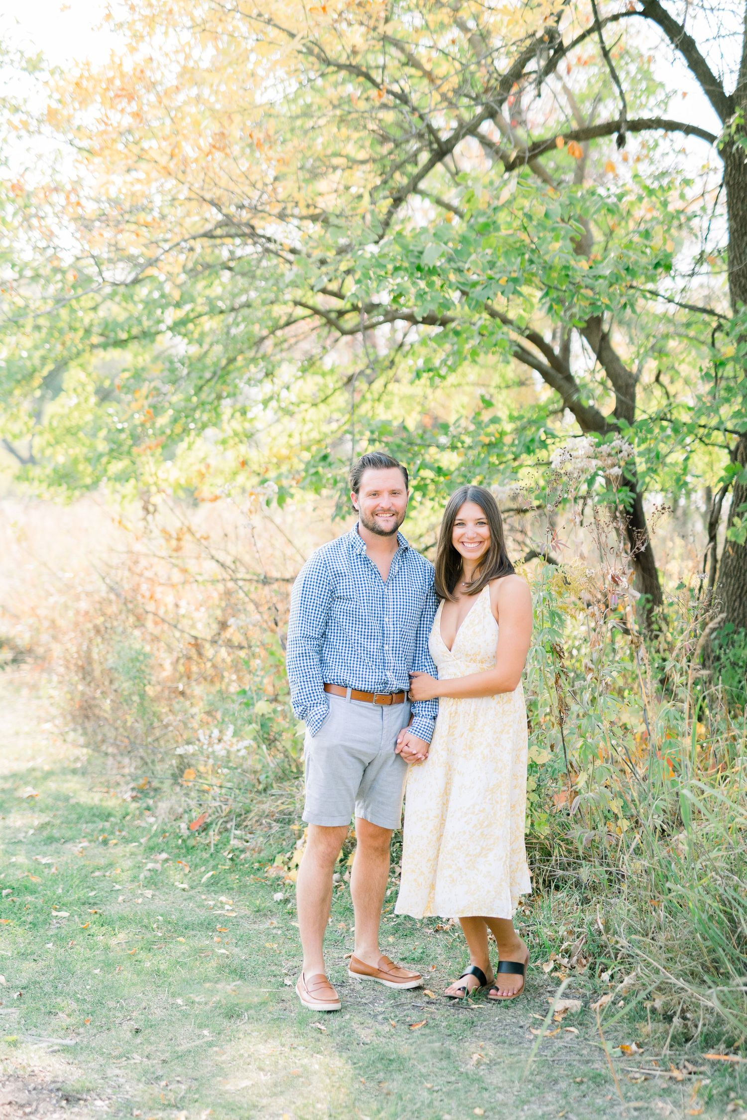Des Moines Engagement photos at Grays Lake in downtown Des Moines, Iowa with light and airy photographer Nicole Laing