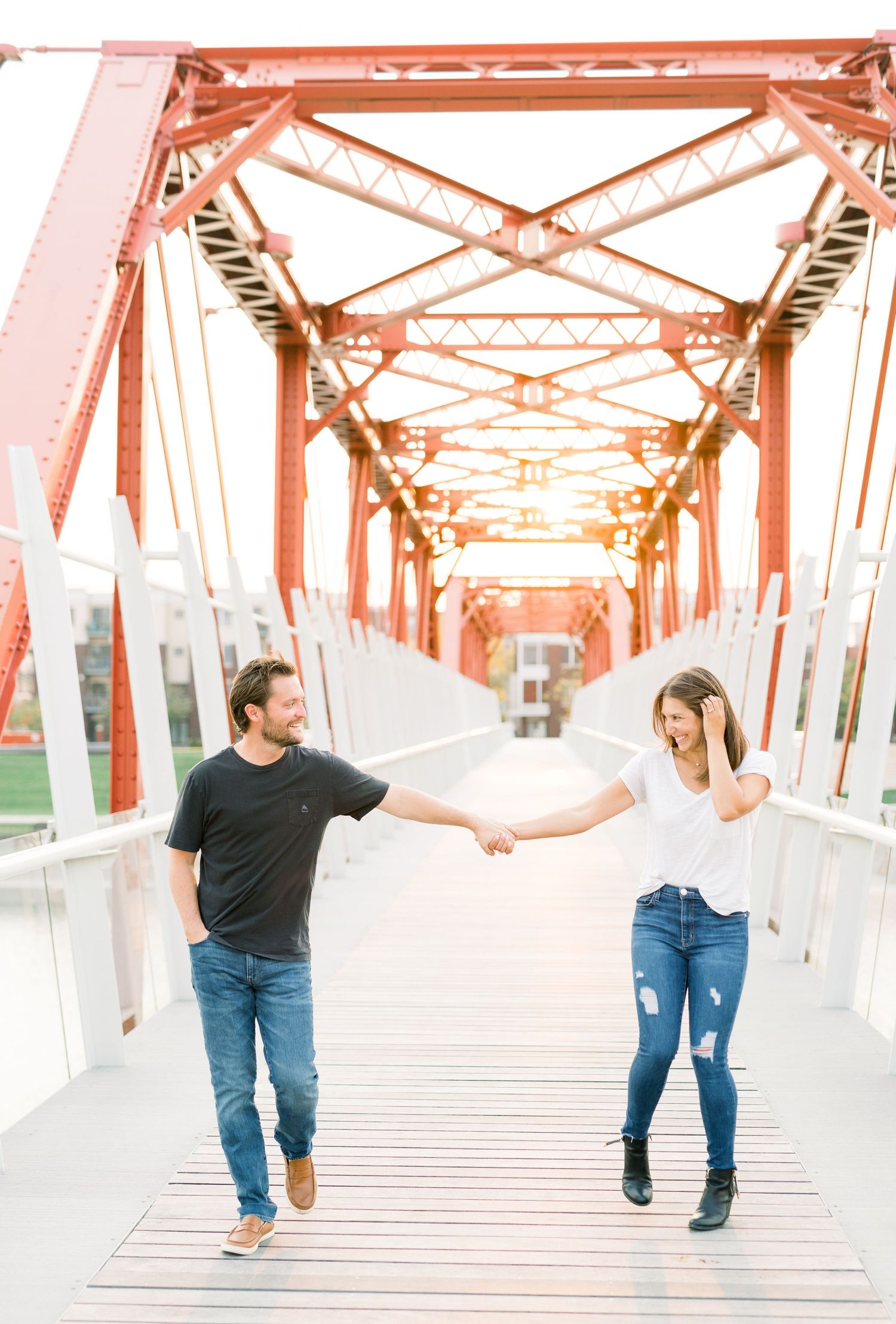 Des Moines Engagement photos in downtown Des Moines, Iowa with light and airy photographer Nicole Laing