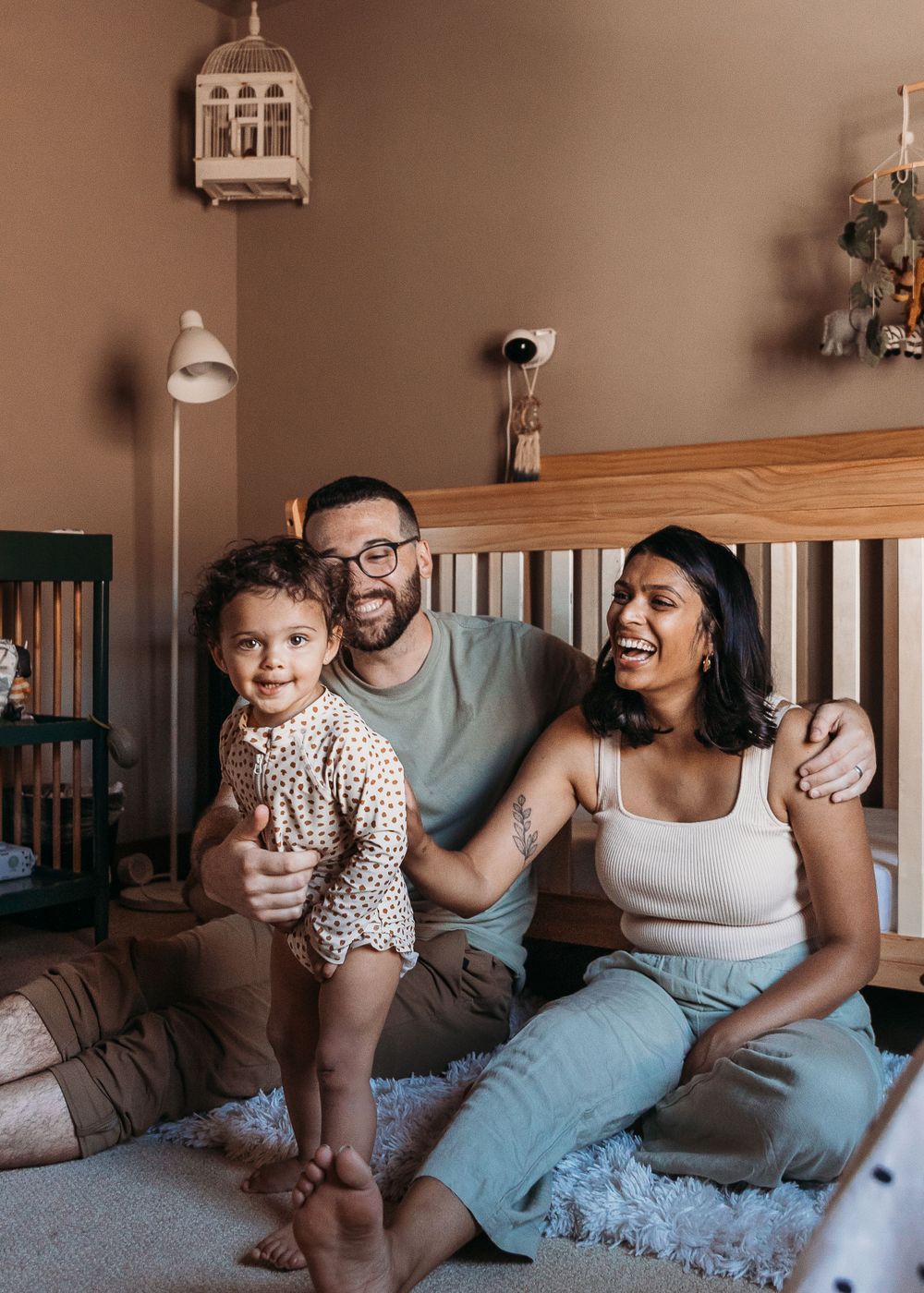 A cozy family moment at home on the sofa in natural lighting.