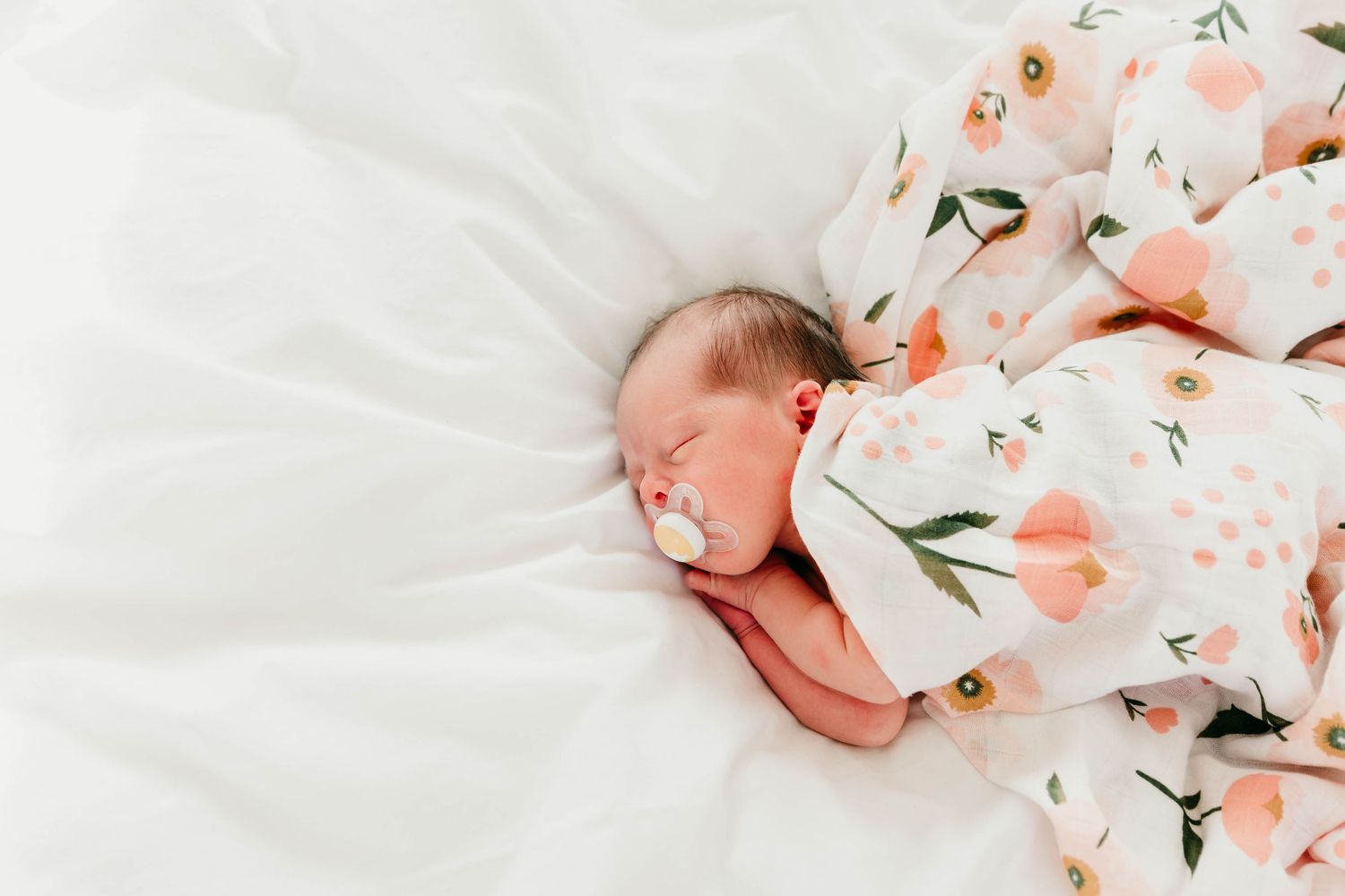sleeping baby covered in blanket