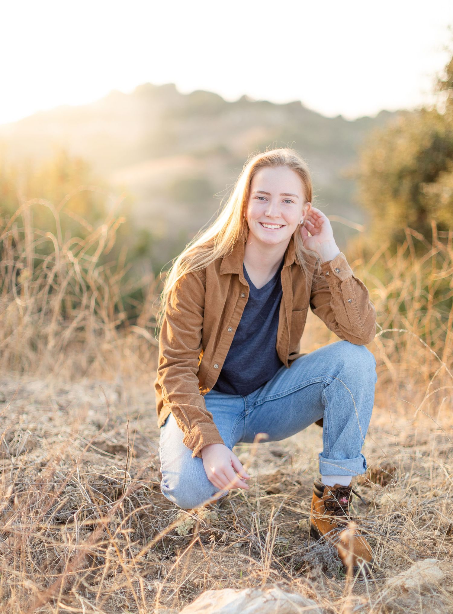 Senior portrait wearing mustard on a mountain