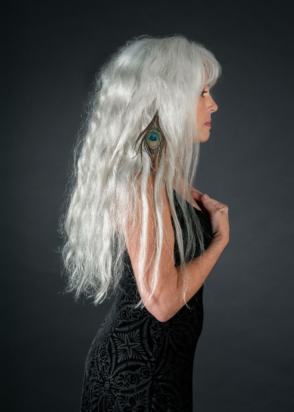 beautiful long silver hair with peacock feather