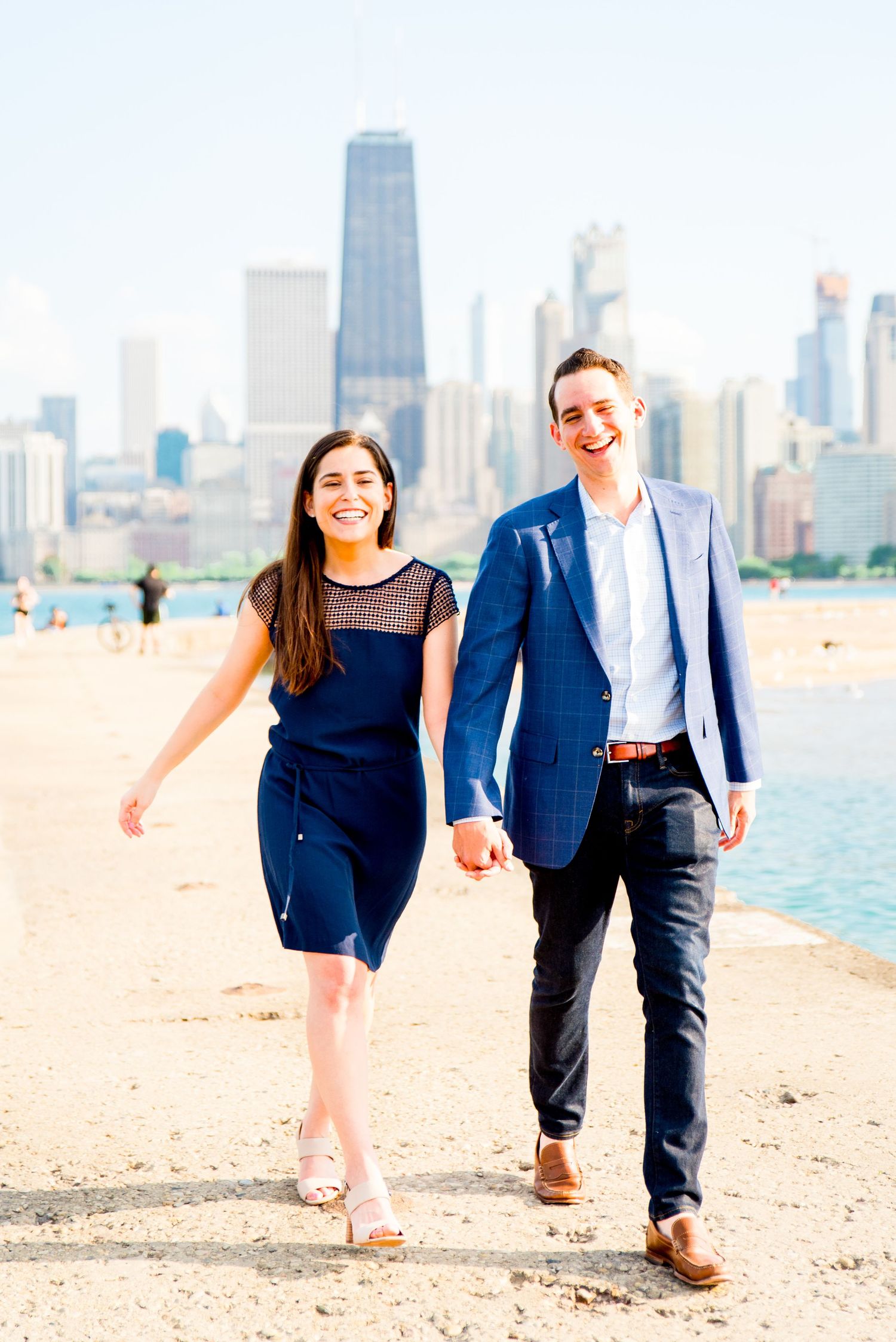 man and woman walking in front of Hancock tower after North Avenue Beach proposal