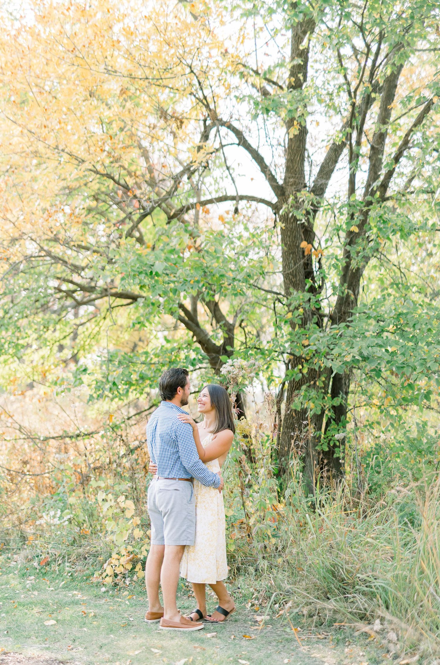 Light and airy film engagement photos in Des Moines, Iowa at downtown des moines