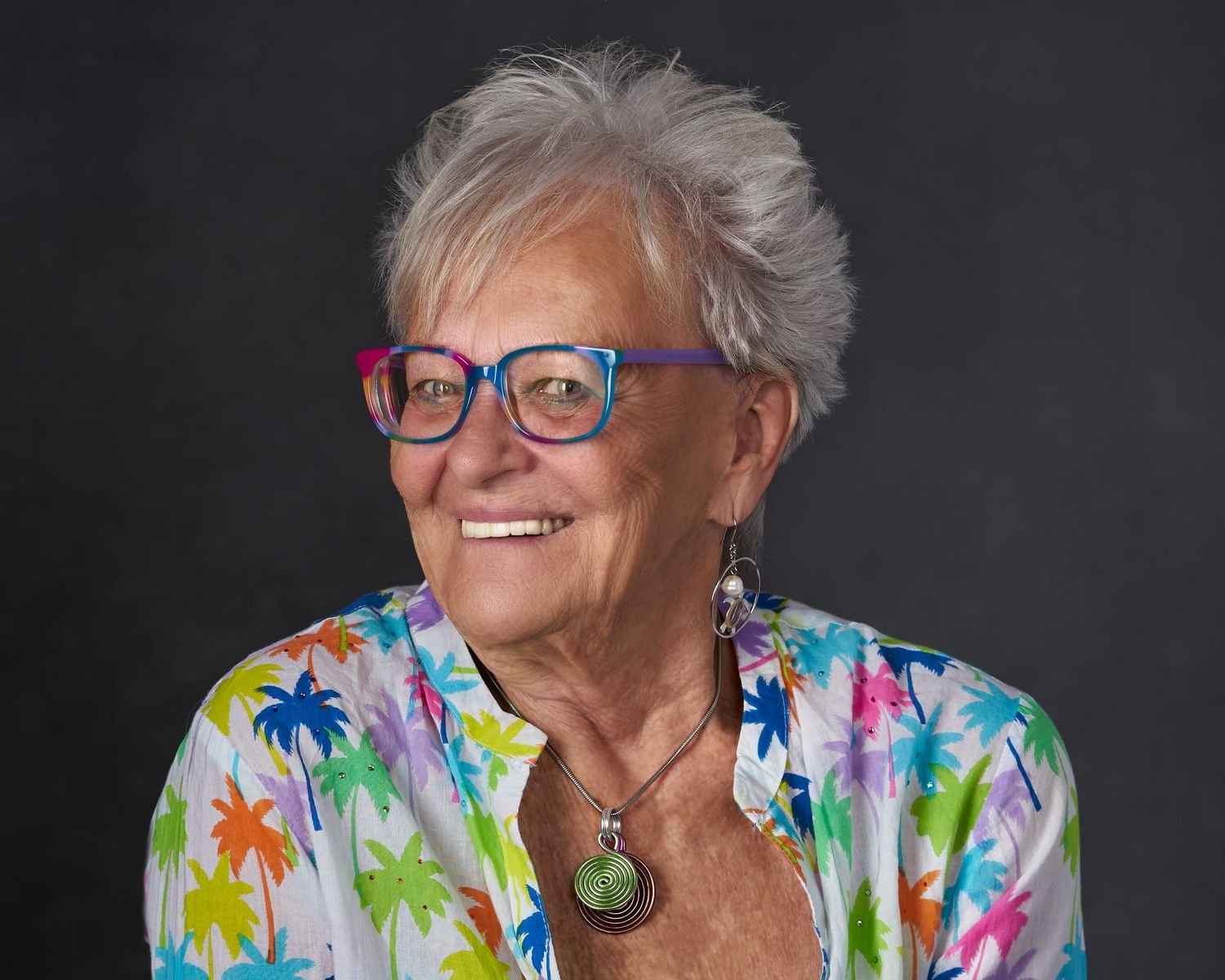 Elder woman headshot with lively colors and expression