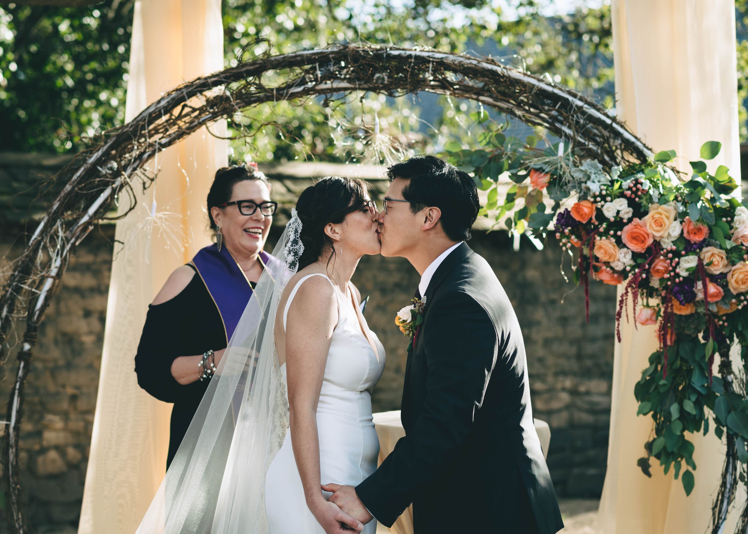 bride and groom have their first kiss as husband and wife