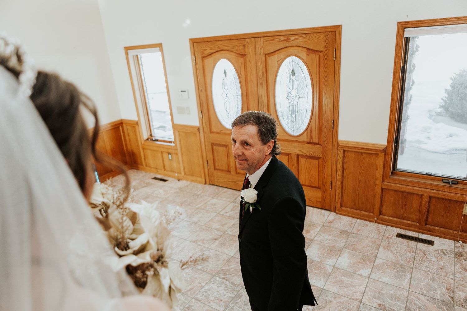Father of the bride looks at his daughter for the first time during the Loveland Wedding.