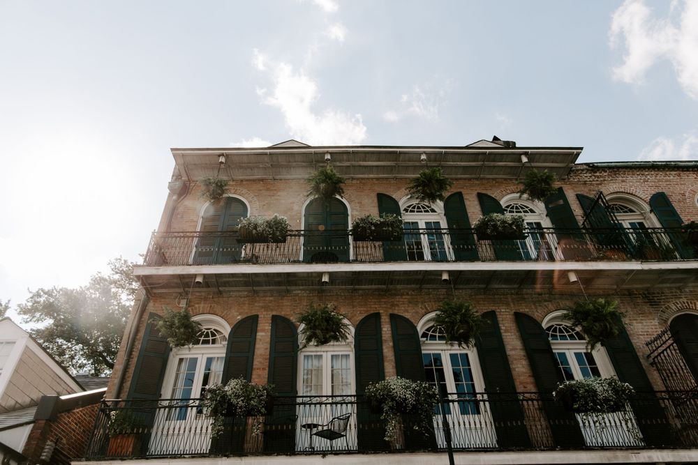 Looking up view of a building in the French Quarter with a double balcony, New Orleans Elopement
