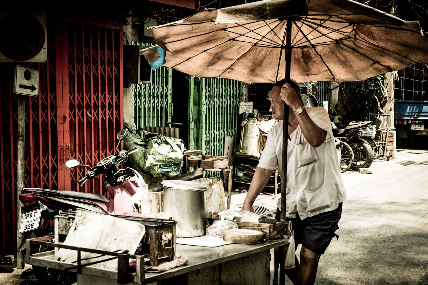 Street food vendor walking in the China town district of in Bangkok Thailand