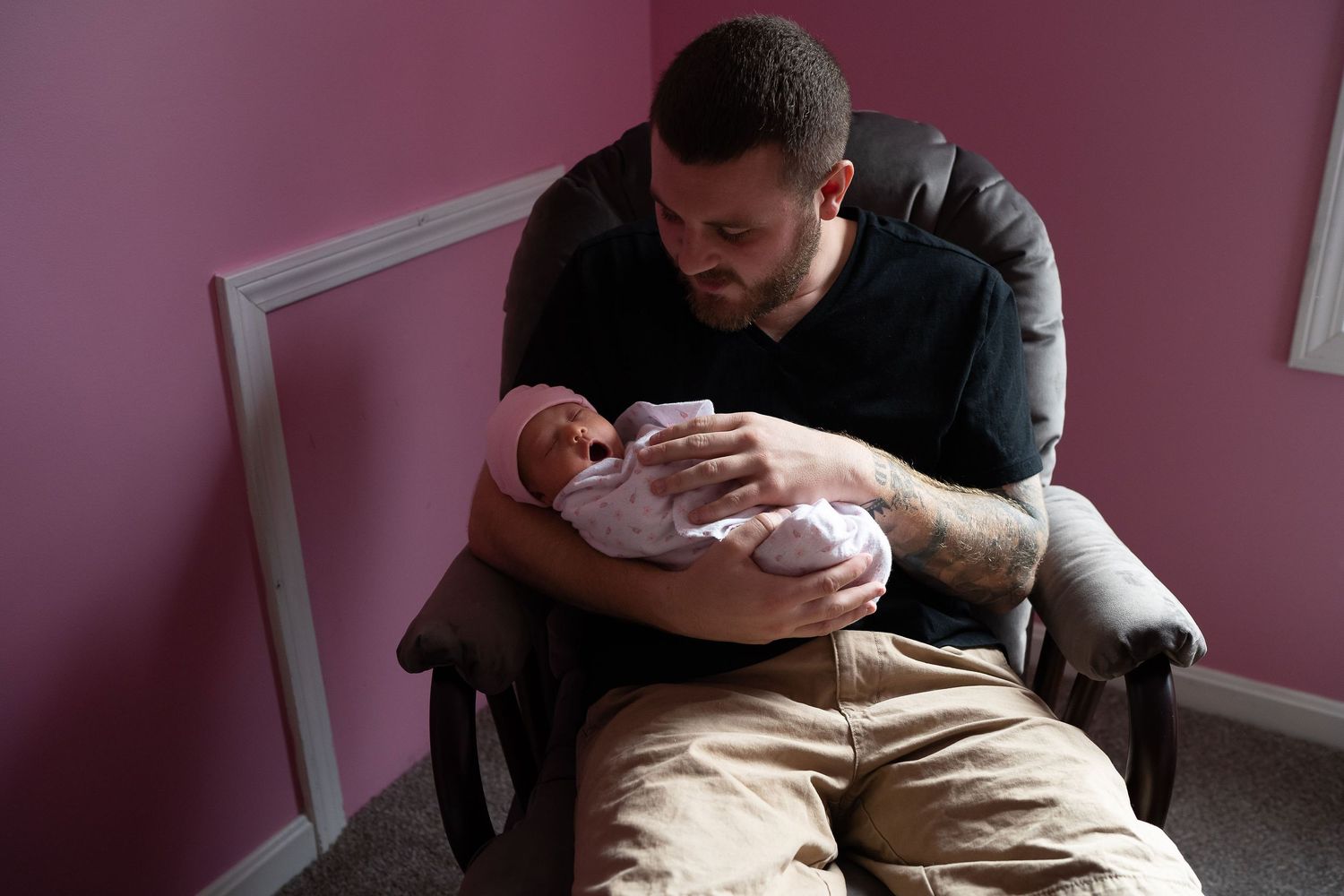 dad rocking newborn baby in sudbury ma homr
