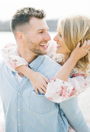 Light and airy film lakeside dock engagement session at Gray's Lake in Des Moines, Iowa