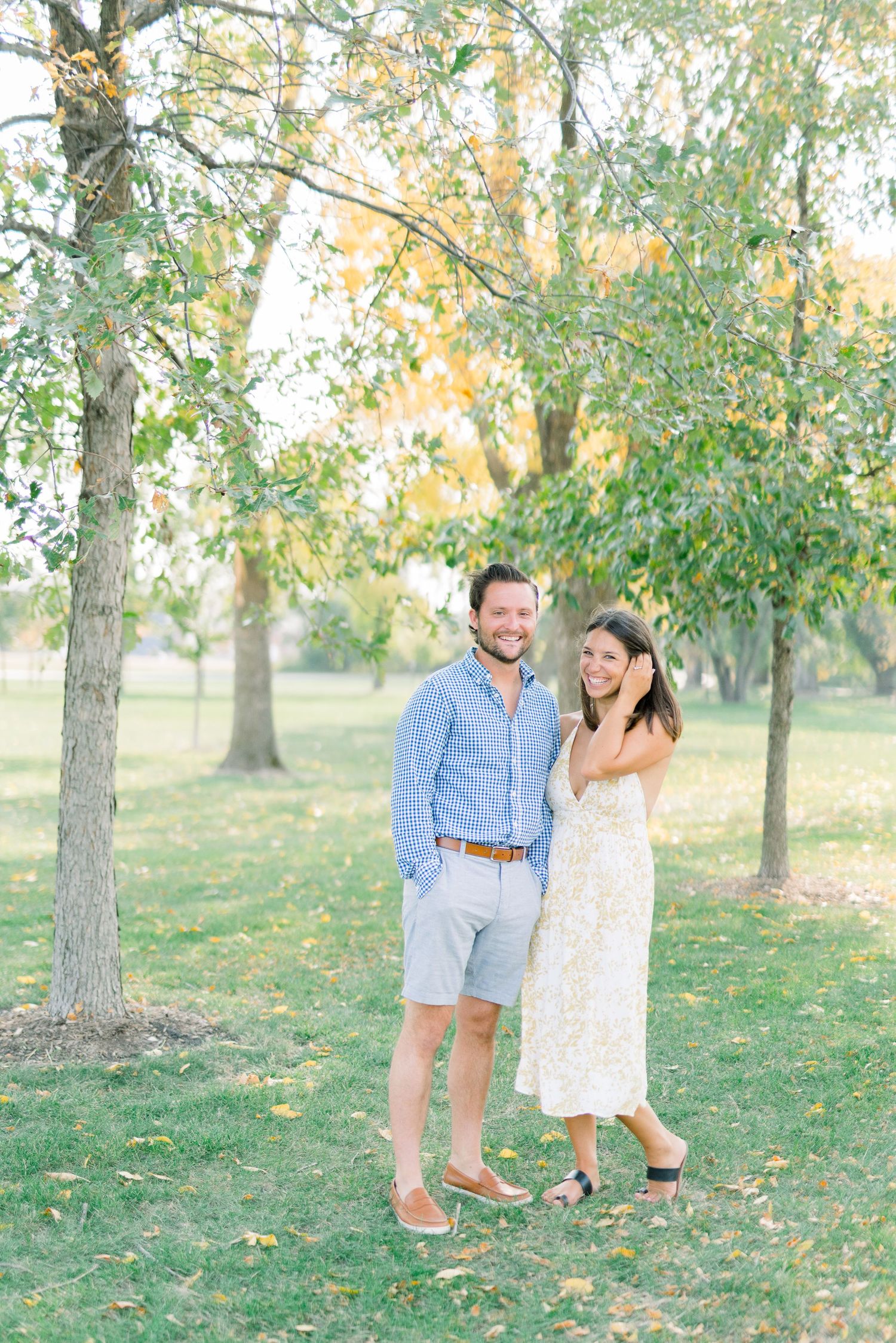 Des Moines Engagement photos at Grays Lake in downtown Des Moines, Iowa with light and airy photographer Nicole Laing