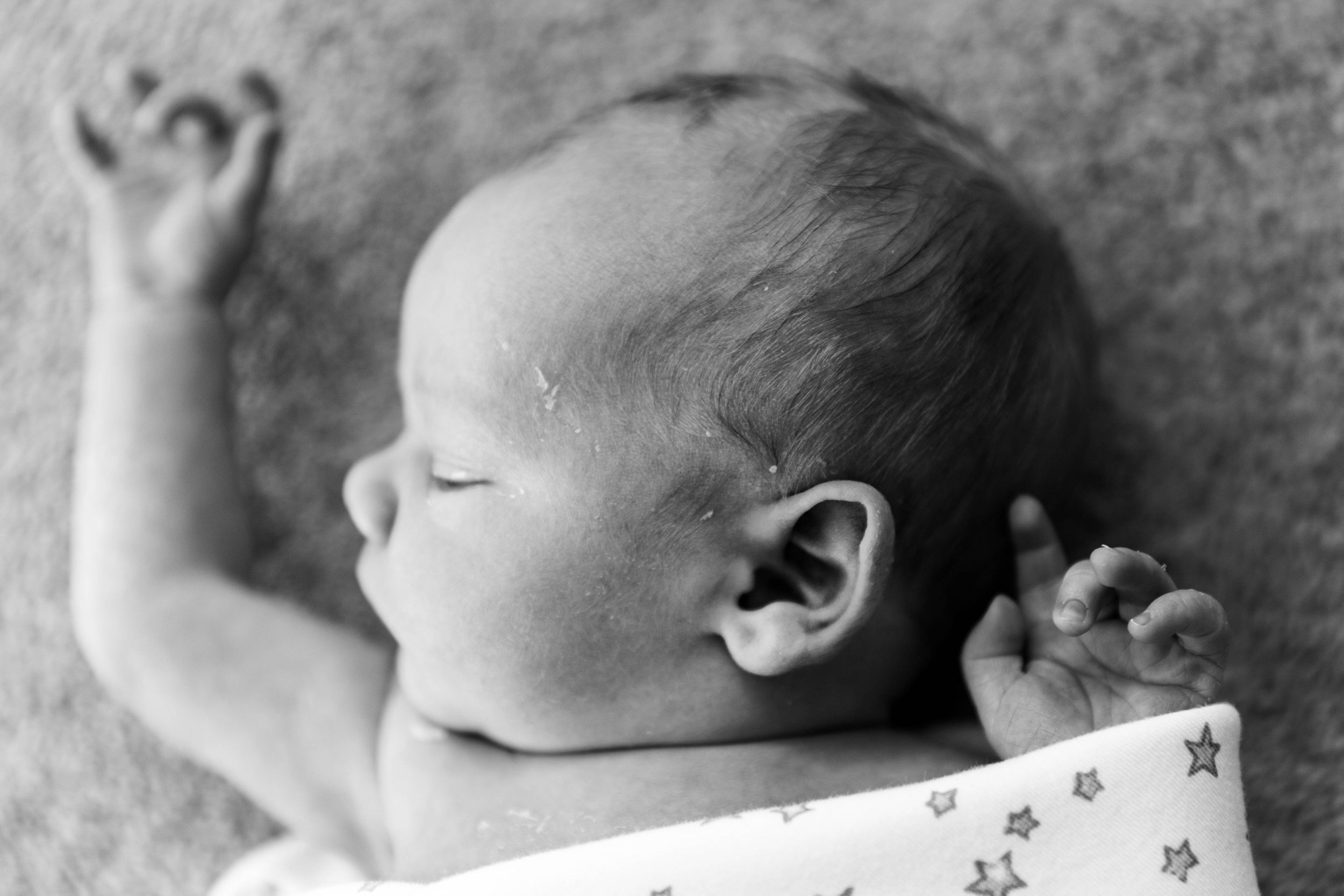 little newborn baby boy profile in black and white