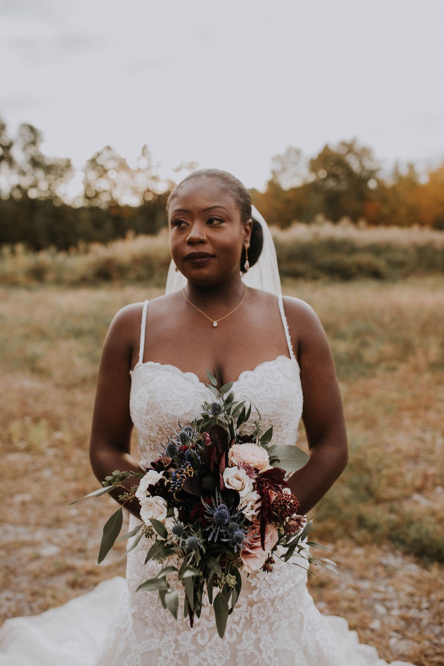 afro american bride posing for her portrait session during her intimate wedding in Quebec, Canada
