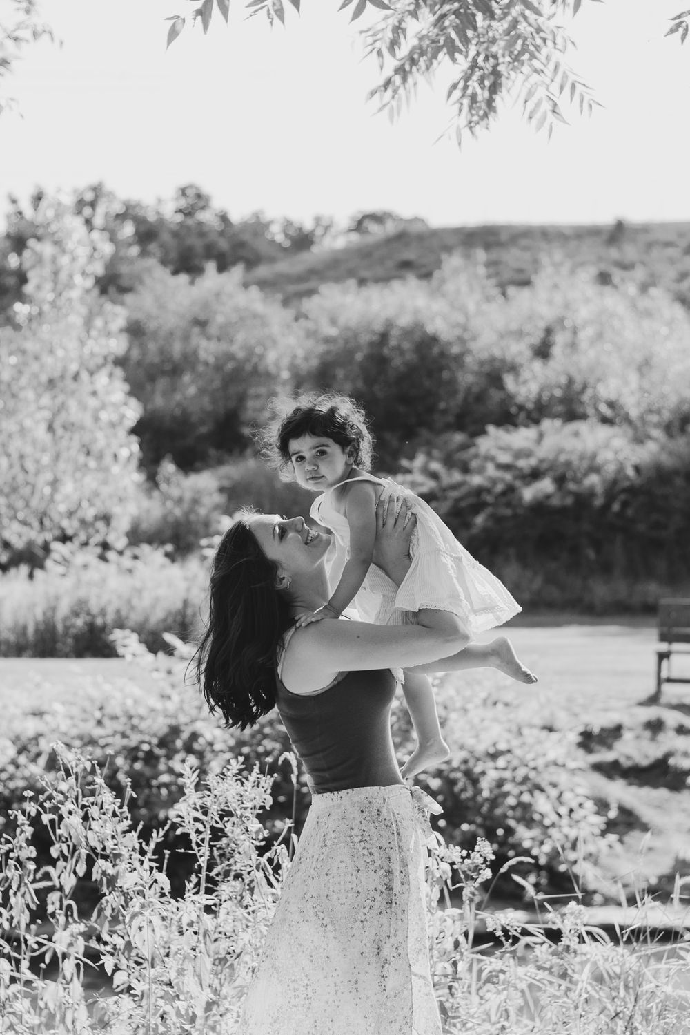 Mom holding daughter in the air in black and white at Emmerling Park in Cheswick Pennsylvania