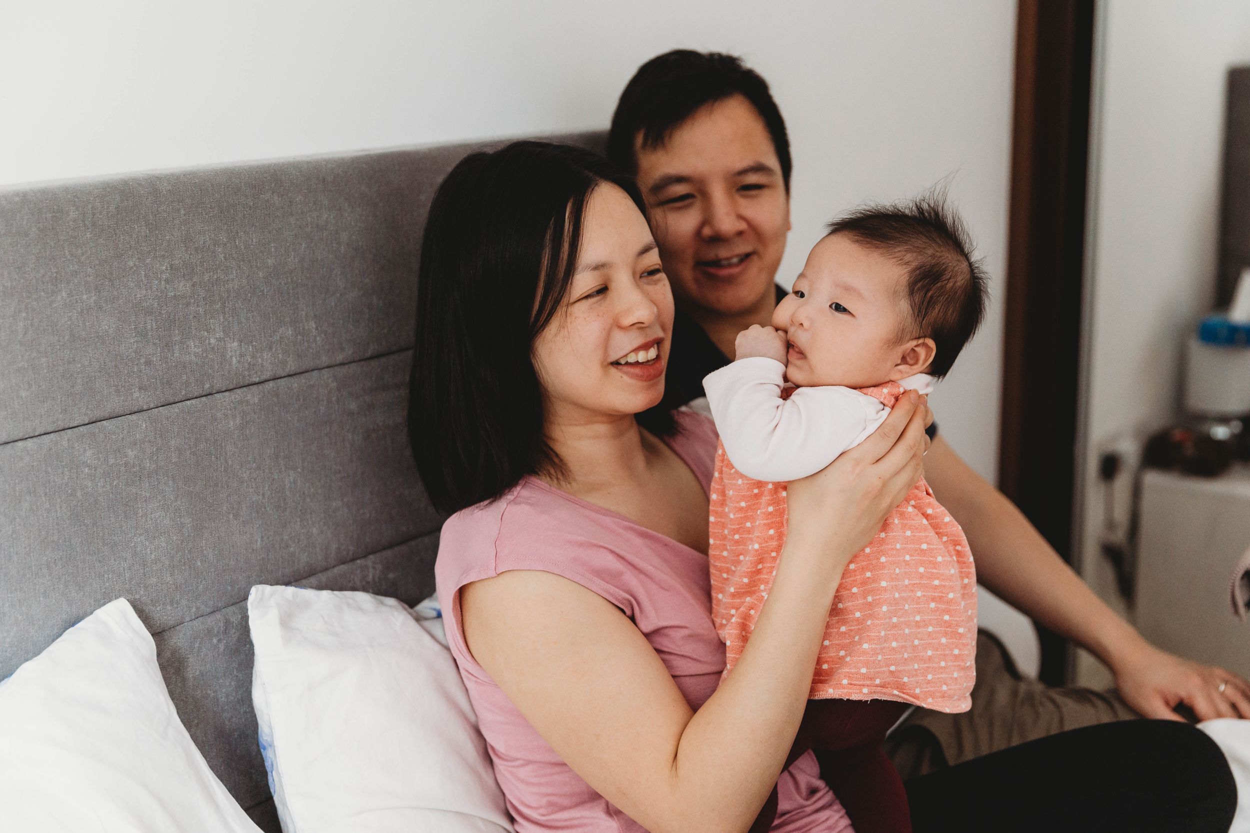 asian family with three month old baby girl