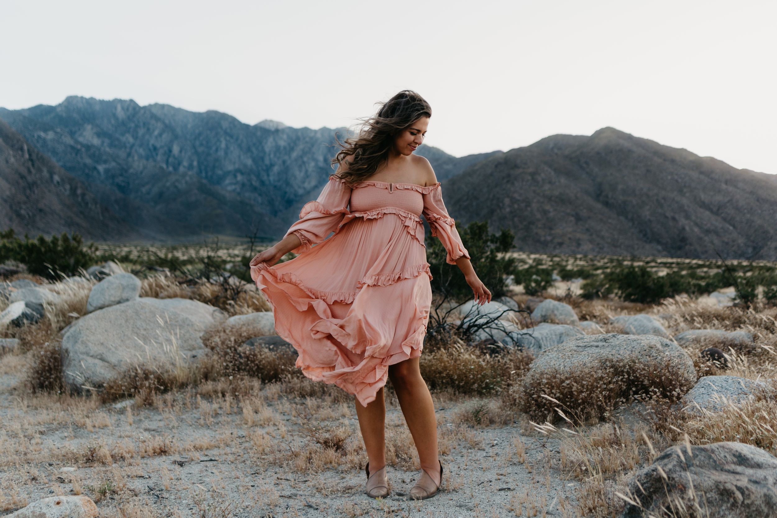 woman in pink dress in the desert palm springs california