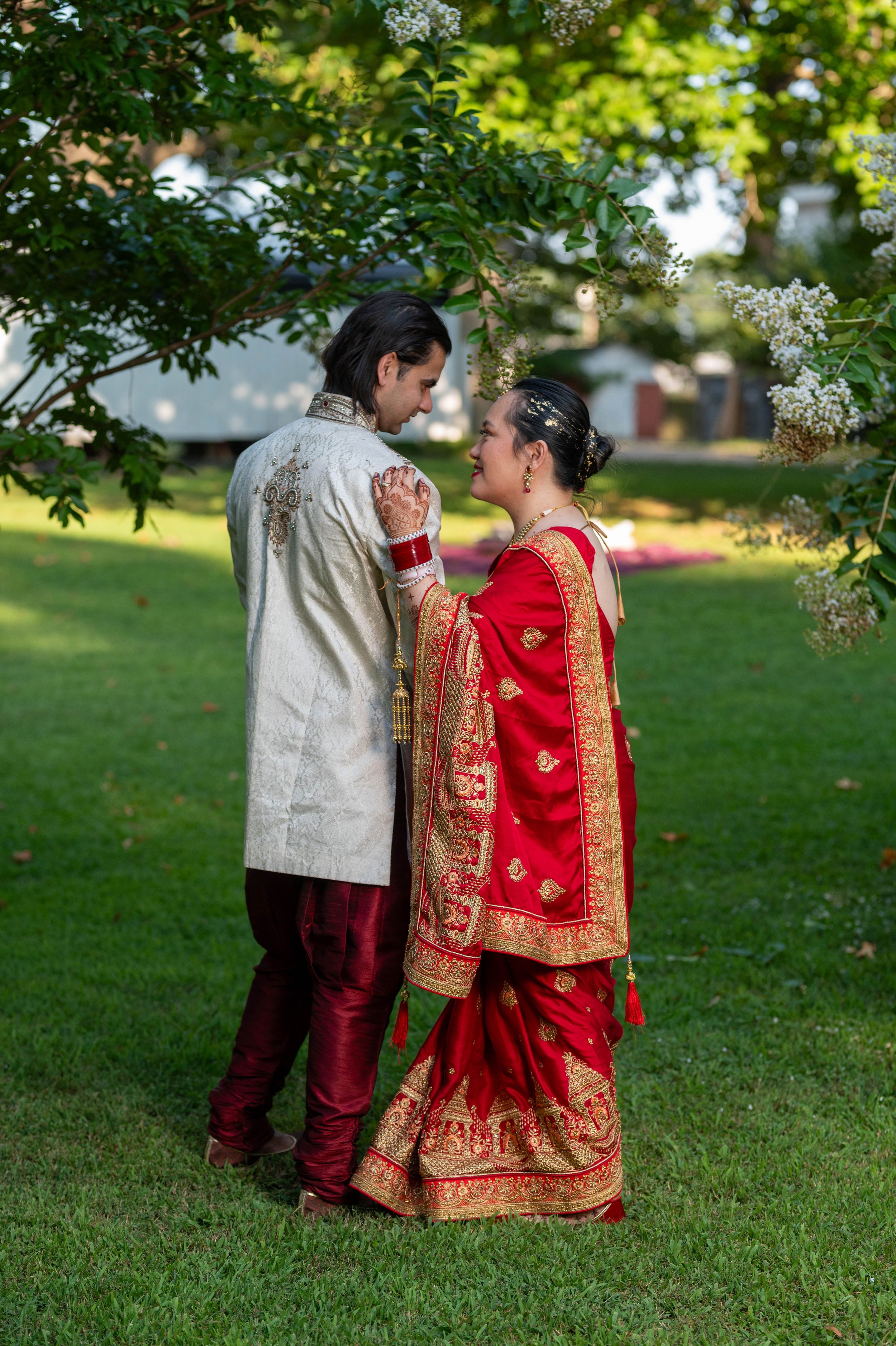 Capturing the beauty of diverse love: an Asian and Indian bride and groom radiating elegance and cultural richness.