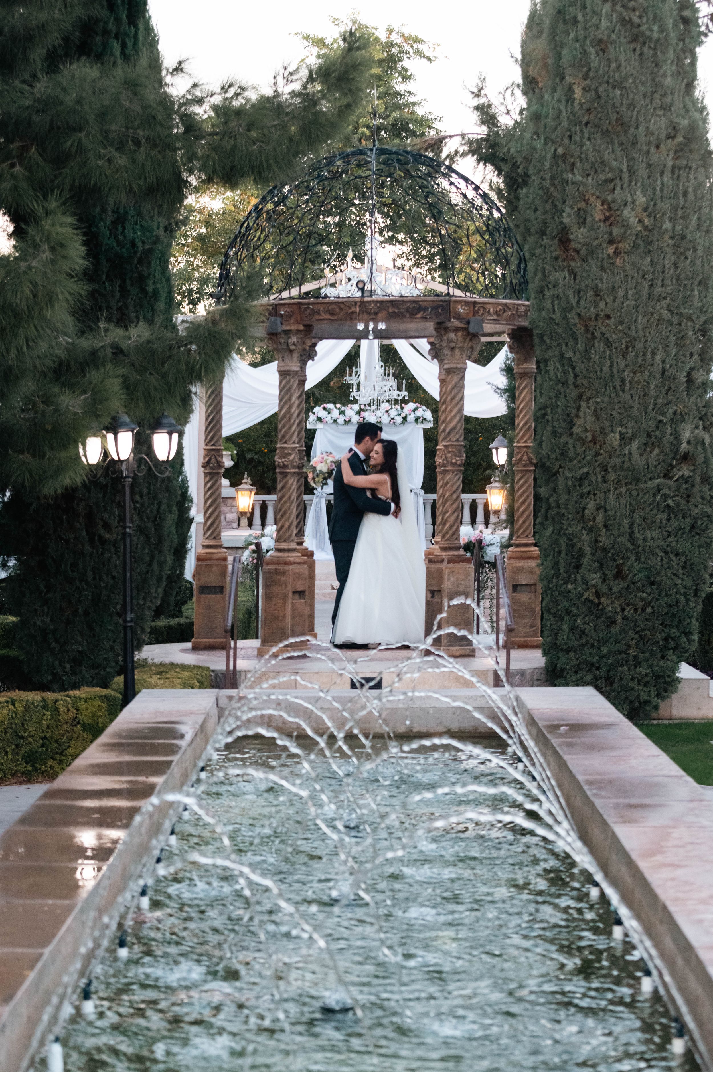 Bride and groom kiss under the gazebo in South Jersey, a perfect snapshot of their love story's beginning