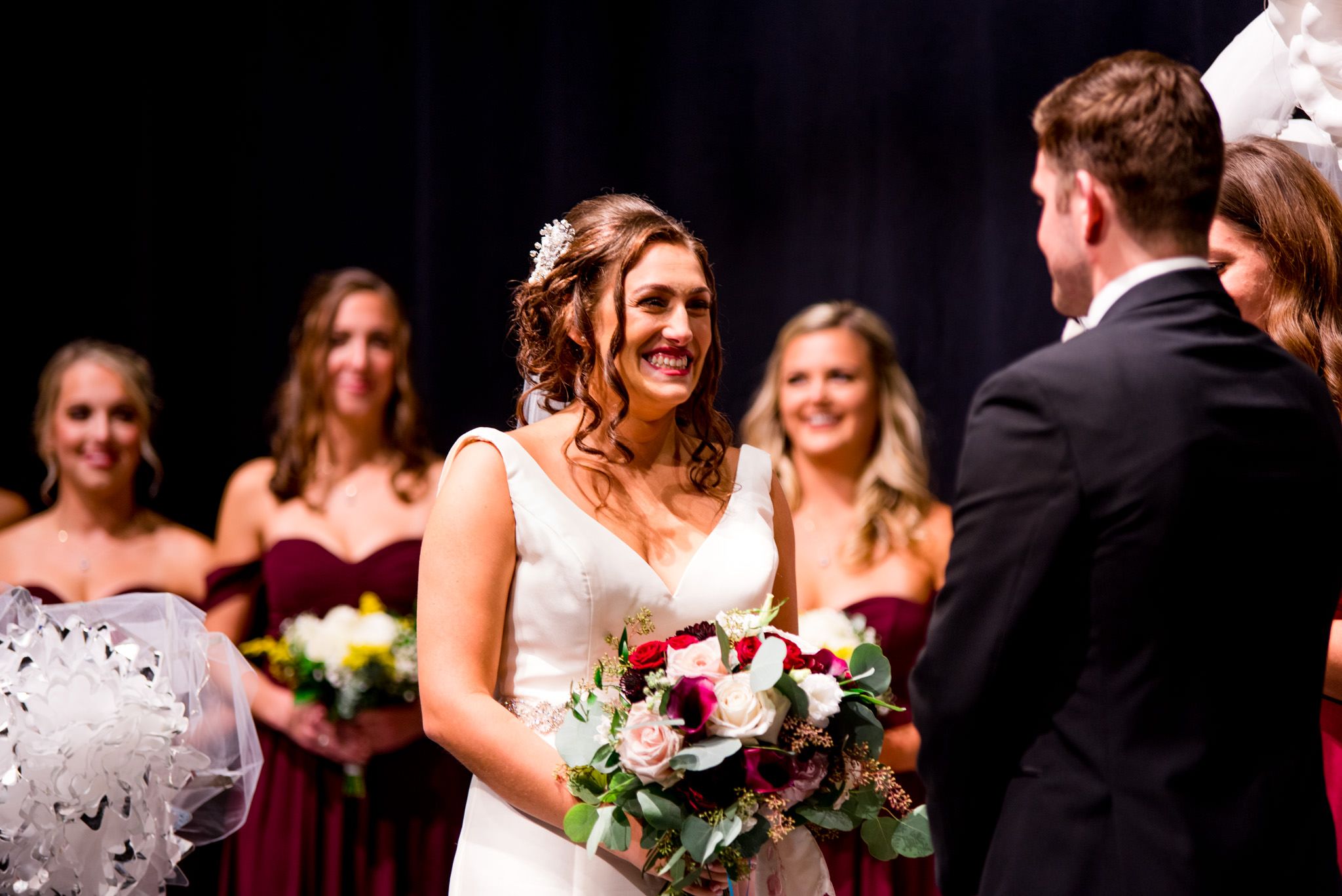 red lipstick and flowers during chicago fall wedding ceremony