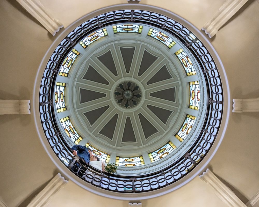 Couple looking down from dome at Storrs Hall in Lake District