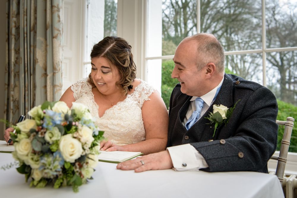 Signing register at Storrs Hall elopement wedding