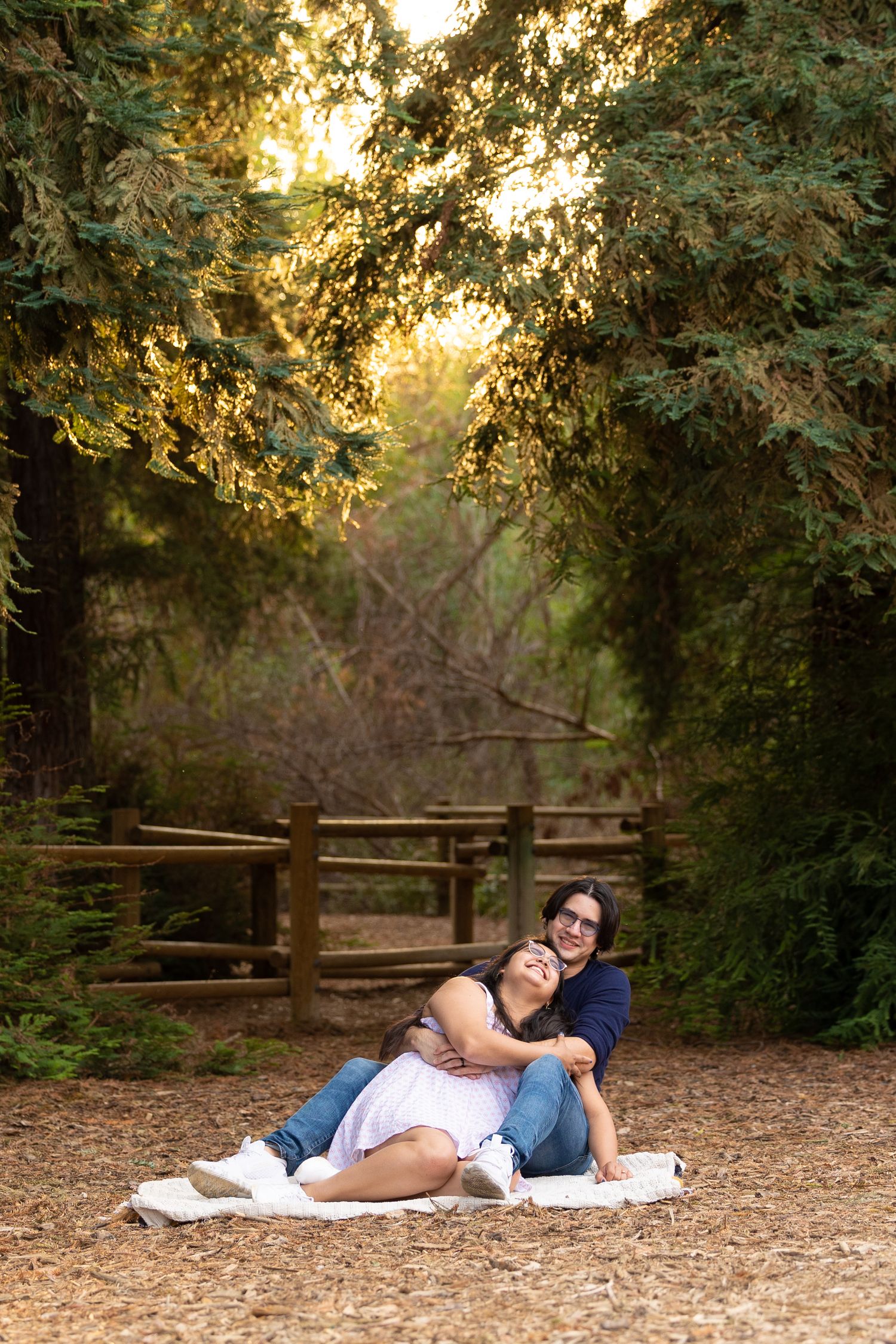 couple sitting on a blanket at carbon canyon park