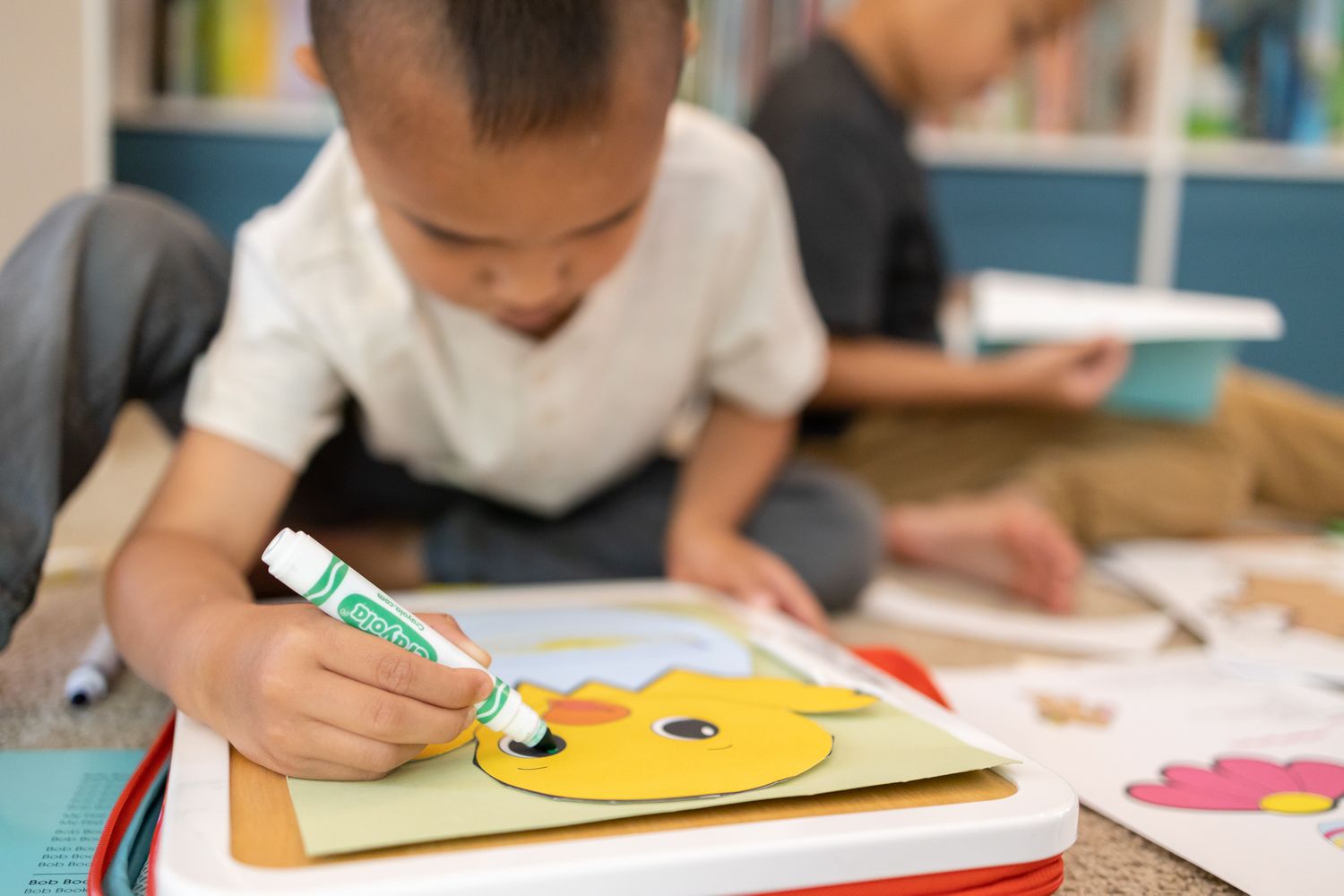 little boy coloring a little chick Homeschooling entrepreneur mom Maple Valley, WA branding photo
