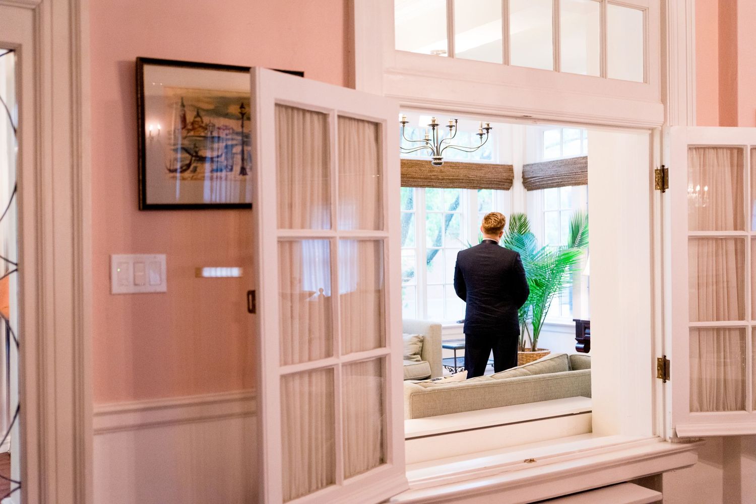 groom's back is turned while he awaits his bride for a wedding at the Woman's Club of Evanston in Chicago, IL