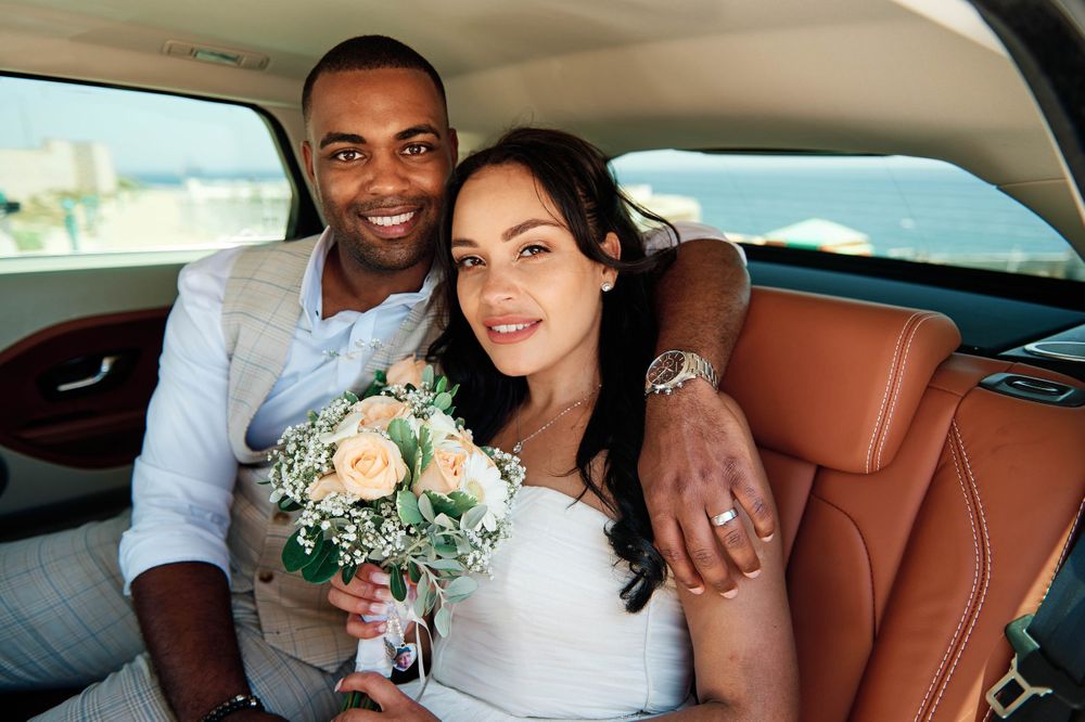 Range Rover portrait of a wedding couple