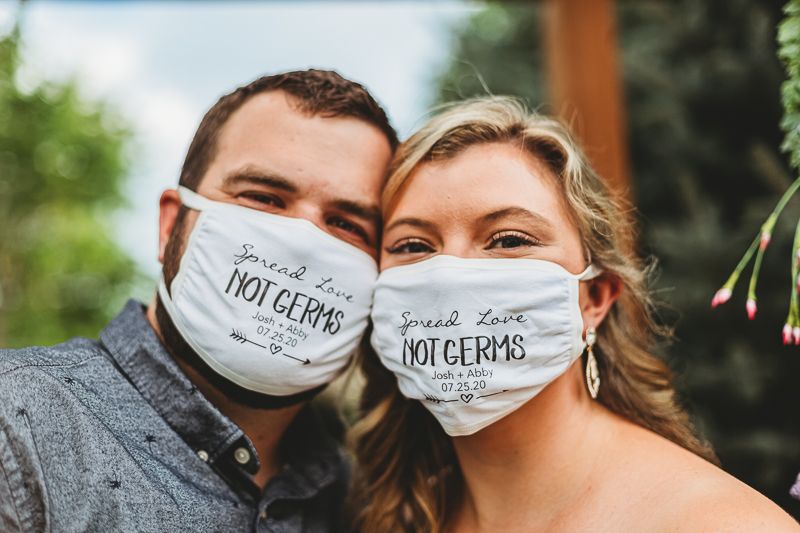 A bride and groom wear masks during their Colorado Backyard Wedding.