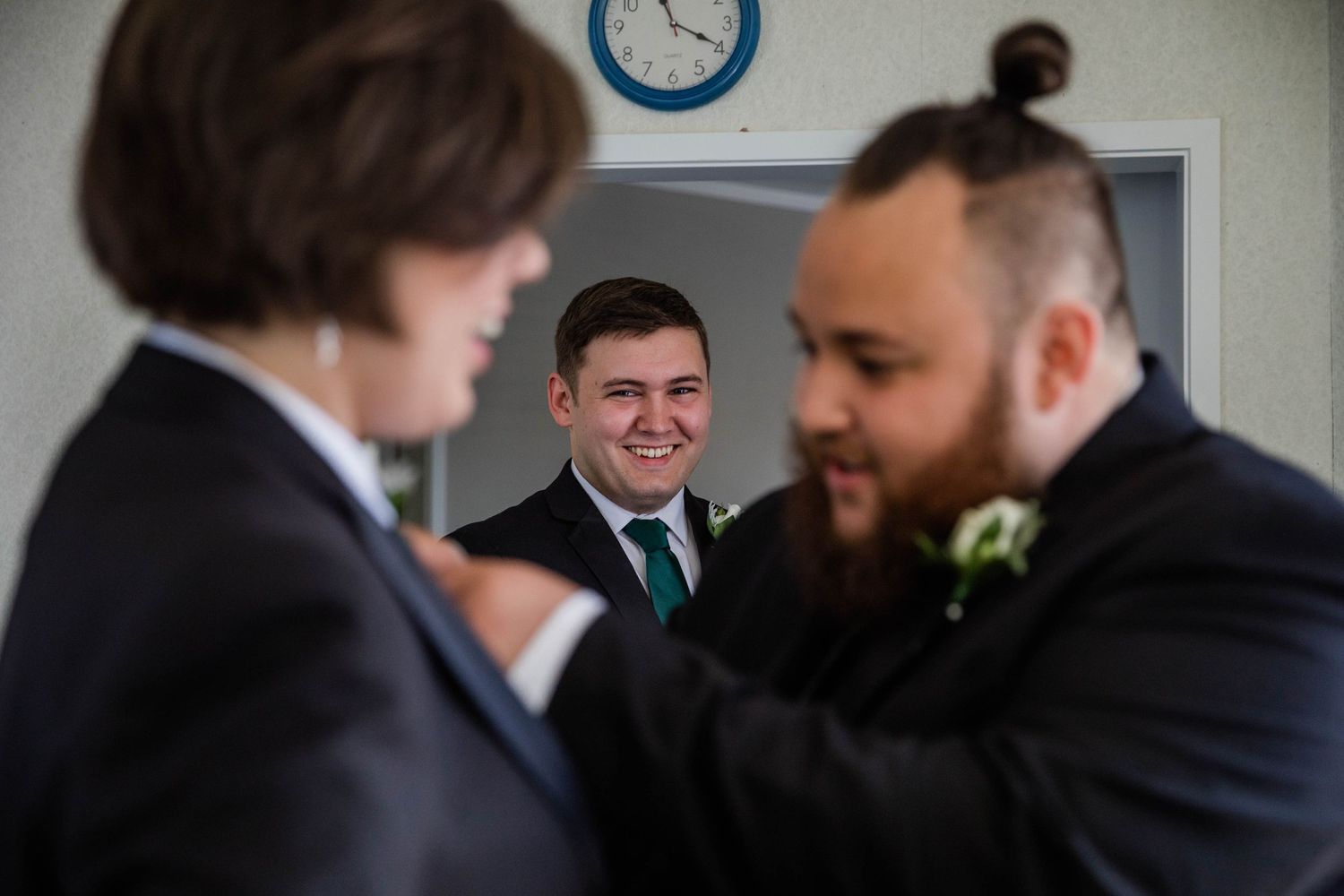 Groom putting on Button holes