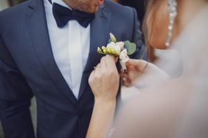 bride fixing groom flower, dallas wedding photographers