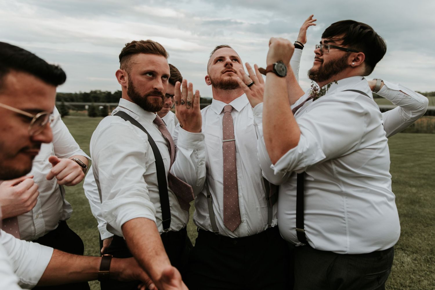 Finger Lakes Groomsmen and groom dancing in a circle