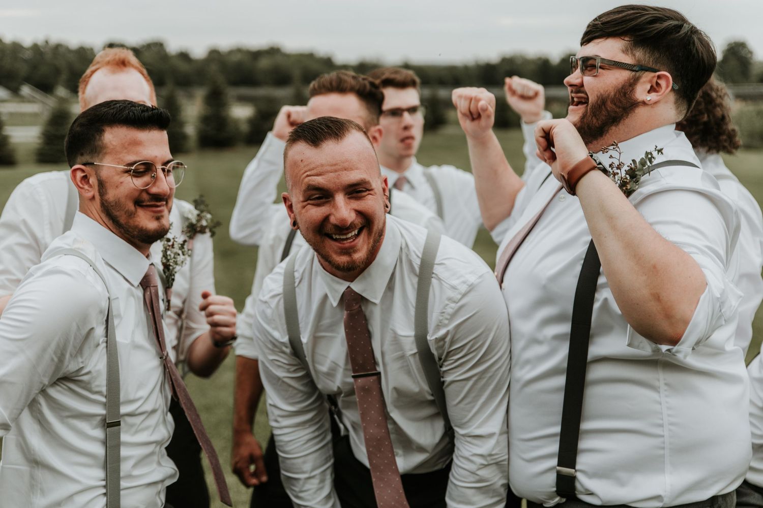 Finger Lakes Groomsmen and groom smiling at the camera