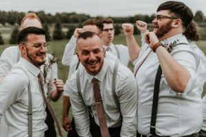 Finger Lakes Groomsmen and groom smiling at the camera
