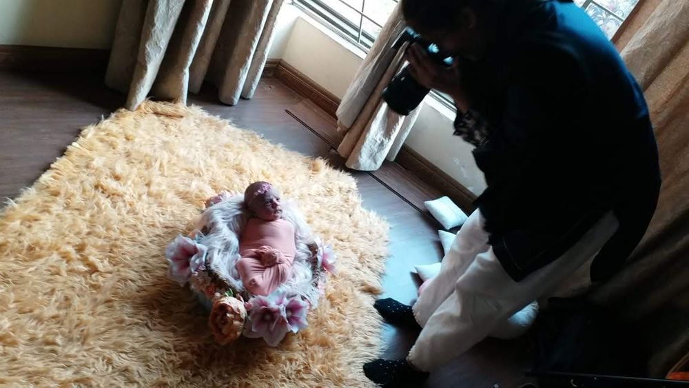 Newborn photographer taking photo of baby in Lahore