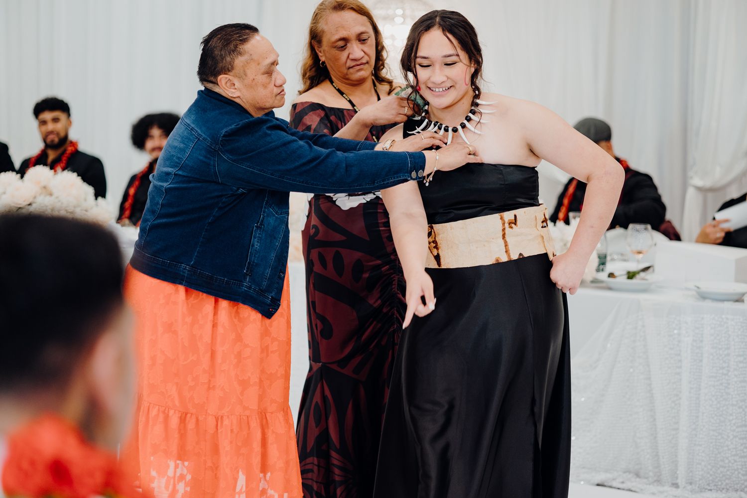 Wedding guests dancing together during reception celebration.