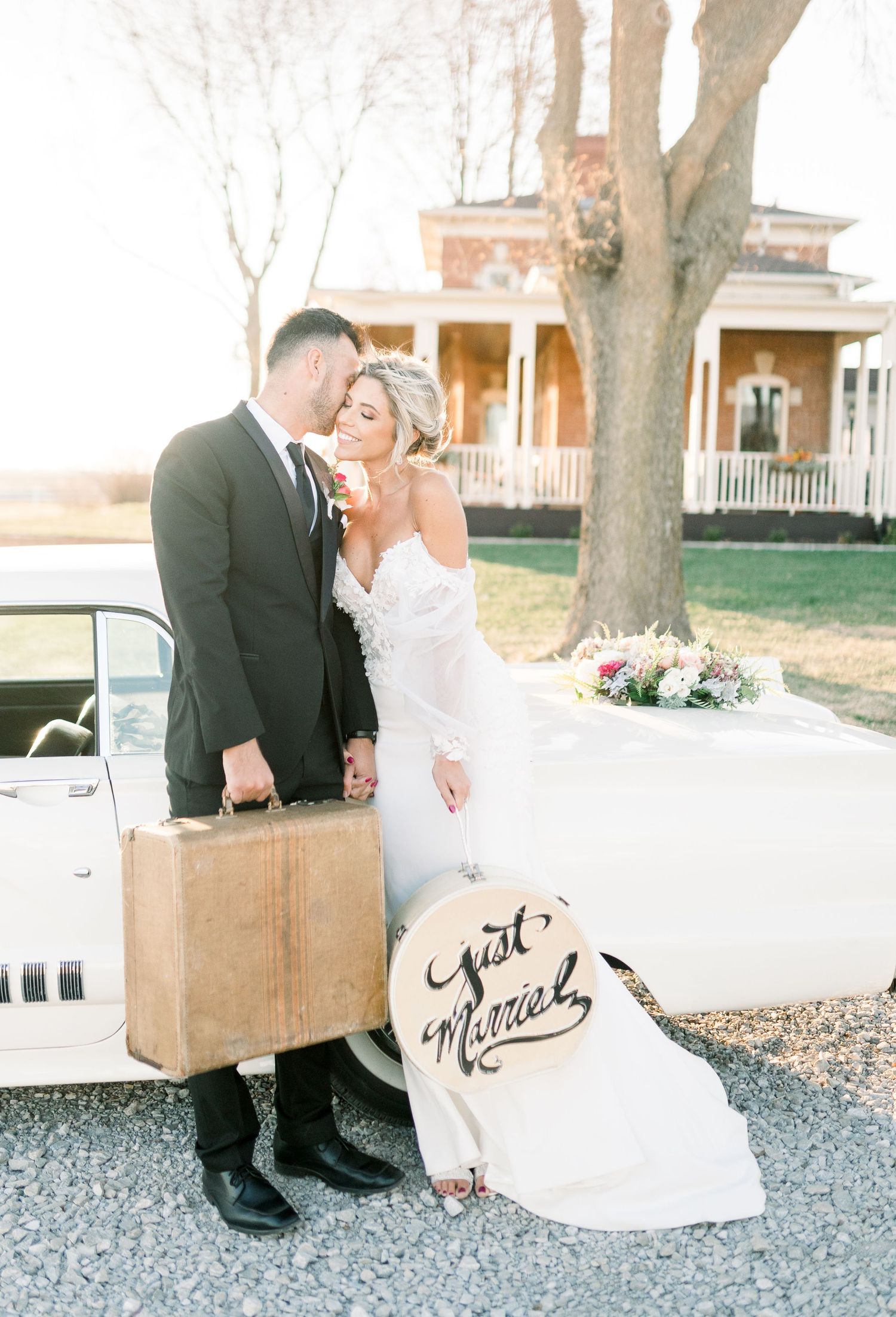 Light and airy Elopement wedding with vintage car at 1868 Farmhouse Wedding in Boone, Iowa with Modern Dress bridal gown