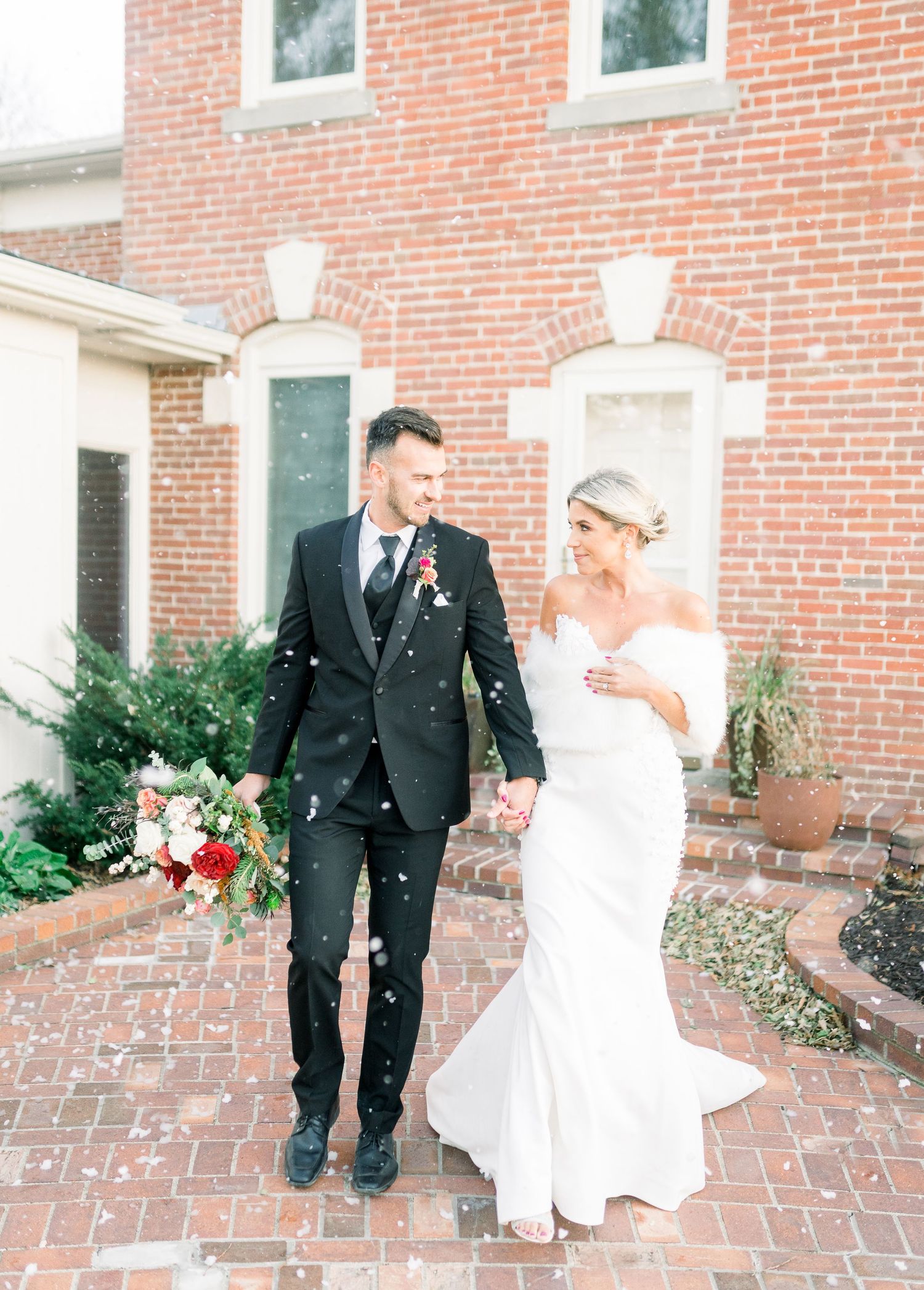 winter wedding at 1868 Farmhouse Wedding in Boone, Iowa with Modern Dress bridal gown
