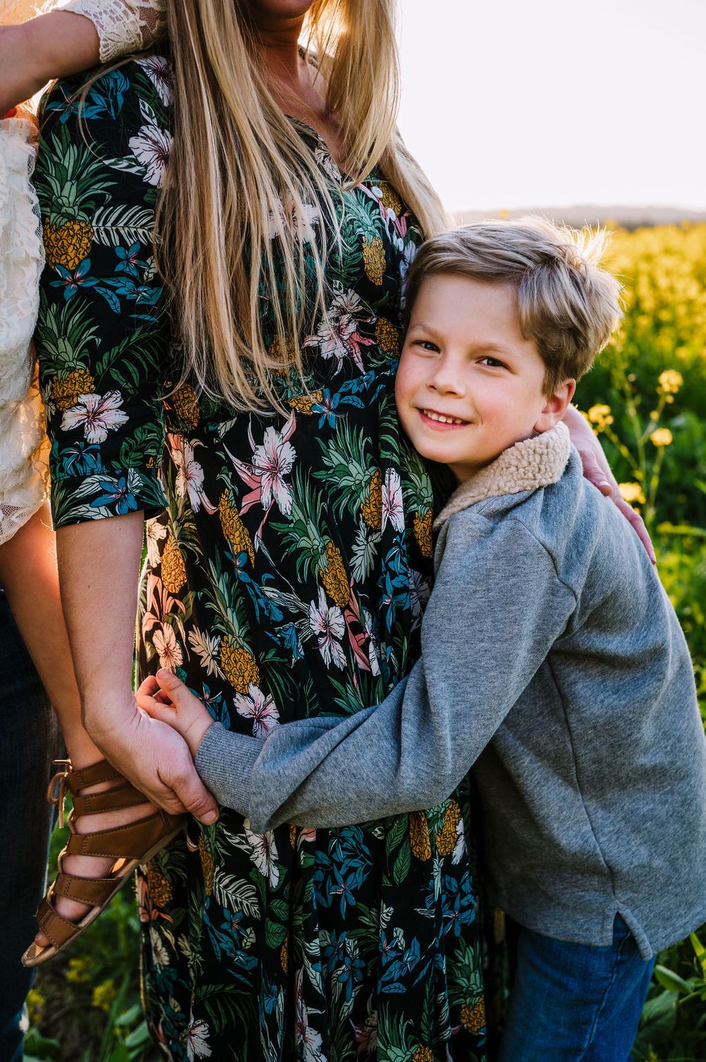 Sonoma County family photography spring session in the blooming mustard fields of wine country showing parents of their