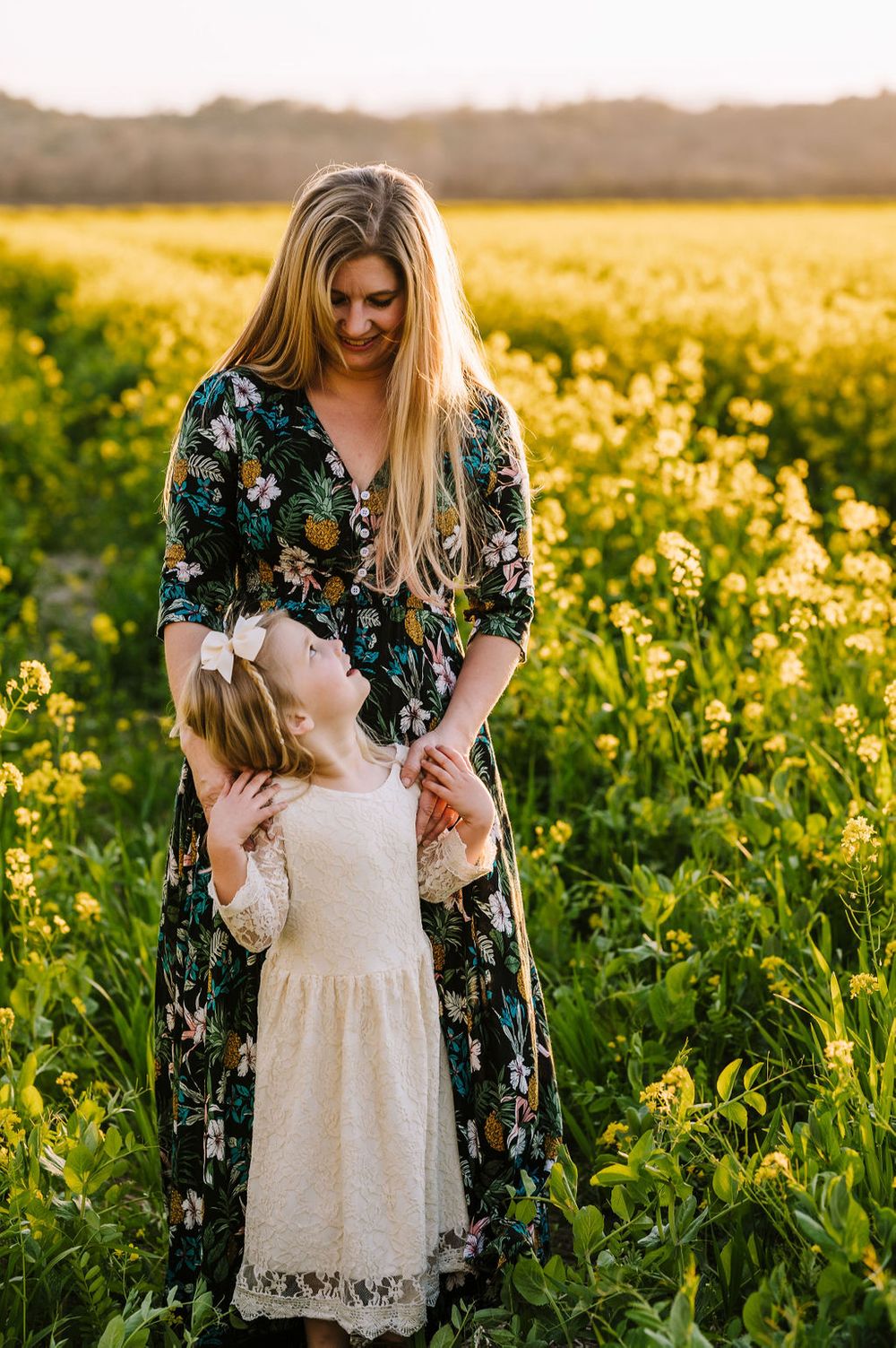 Sonoma County family photography spring session in the blooming mustard fields of wine country showing parents of their