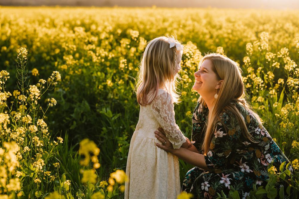 Sonoma County family photography spring session in the blooming mustard fields of wine country showing parents of their