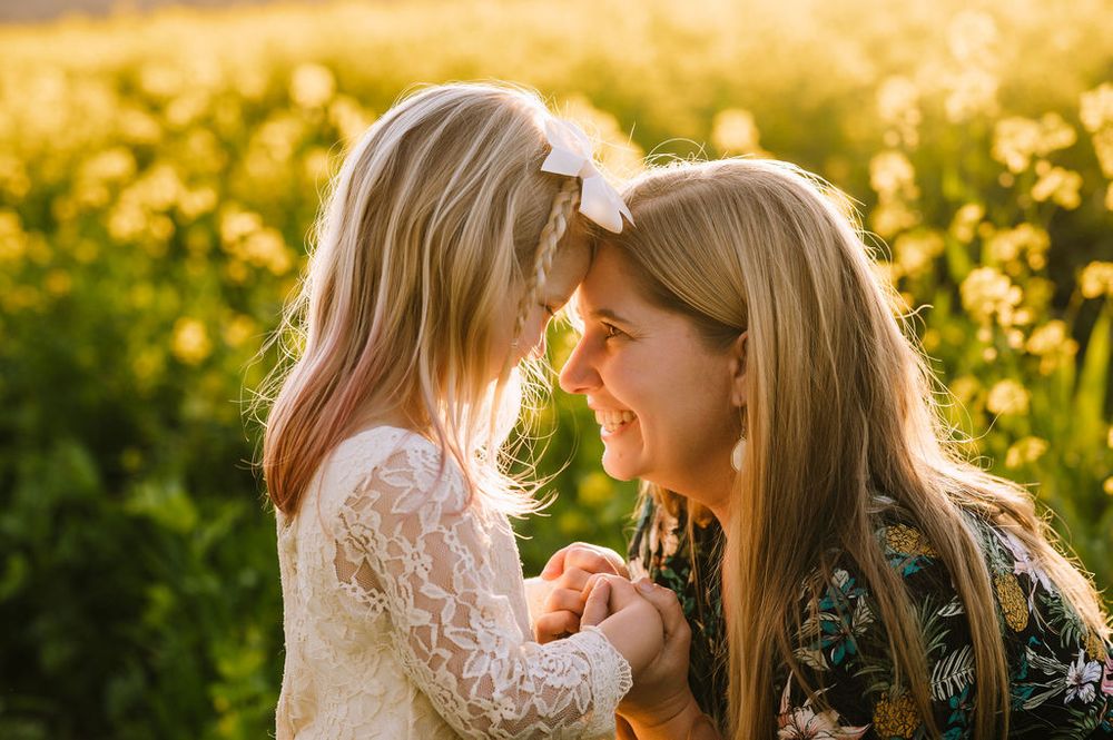 Sonoma County family photography spring session in the blooming mustard fields of wine country showing parents of their